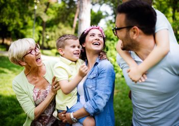 Multi generation family enjoying picnic in a park